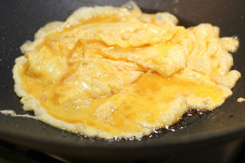 running eggs cooking inside a wok