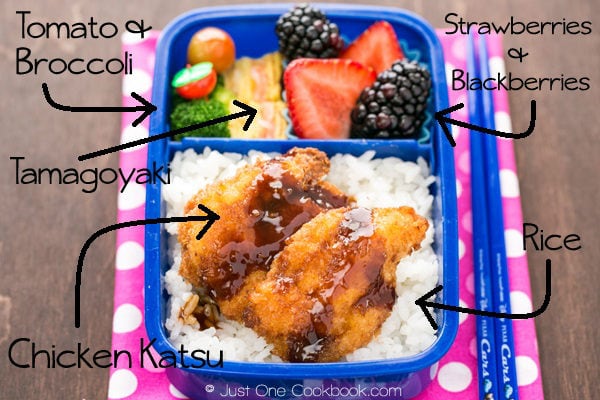 Chicken Katsu Bento with rice, egg , and fruit.