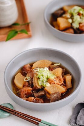 A grey dish containing Japanese beef tendon stew.