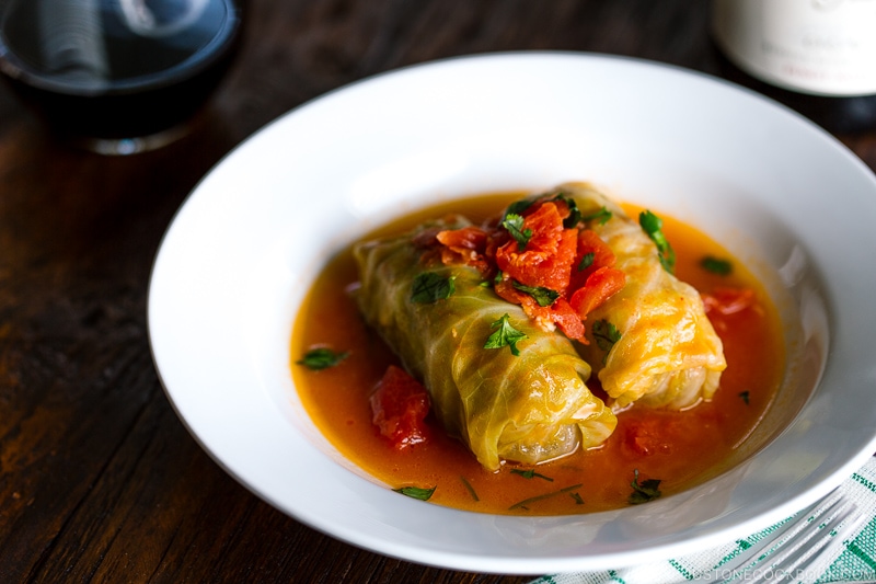 White bowl containing Japanese stuffed cabbage rolls.