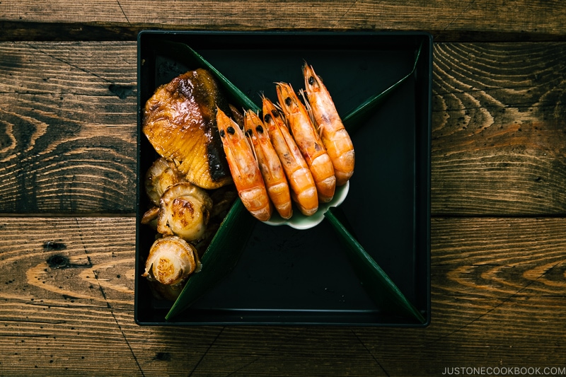 Shirmp, scallop, and fish in the osechi box.
