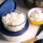 Glass airtight containers with steamed rice in them.