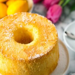 Meyer Lemon Chiffon Cake on a white cake stand.