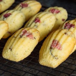 Cherry Blossom Madeleines on a wire rack.