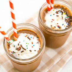 Chocolate banana smoothies in a mason jar.