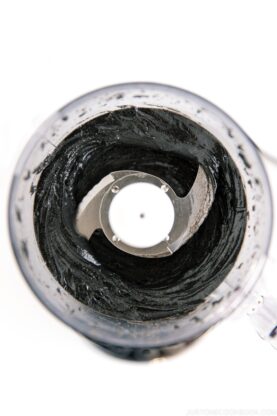 Food processor containing homemade black sesame paste.