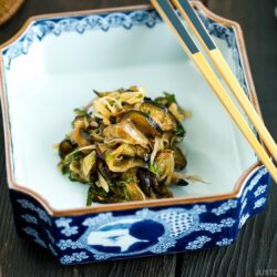 Eggplant and Myoga Salad in a boxed dish.
