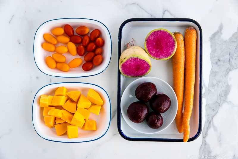 Trays of red vegetables.