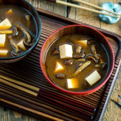Japanese wooden bowls containing Nameko Mushroom Miso Soup.