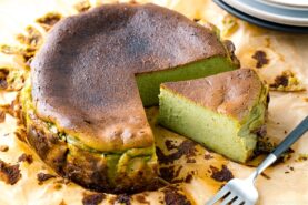 A Matcha Basque Burnt Cheesecake on top of the parchment paper.