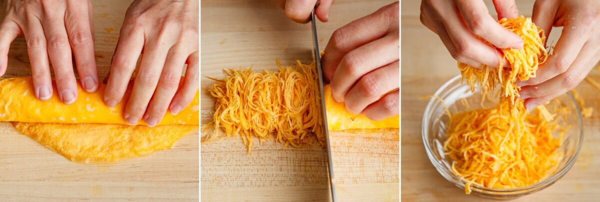 Three-panel image: hands rolling up cheddar cheese, slicing the roll into thin strips like kinshi tamago, and separating the strips into shreds over a glass bowl on a wooden surface.