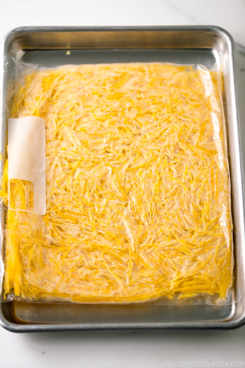 A plastic bag containing yuzu zest.