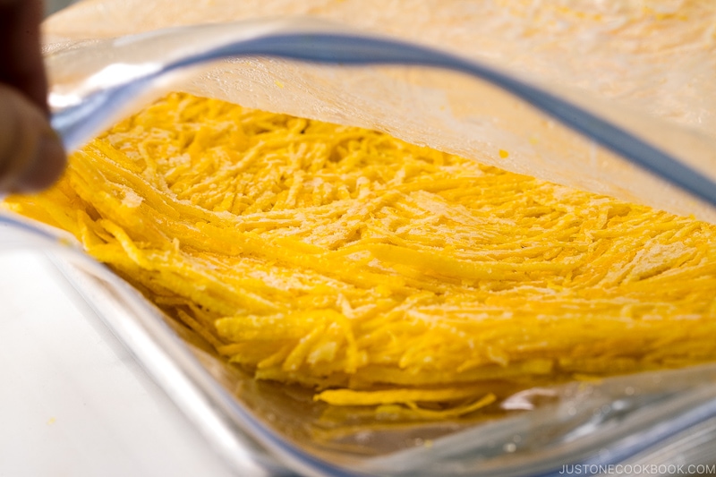 A plastic bag containing yuzu zest.