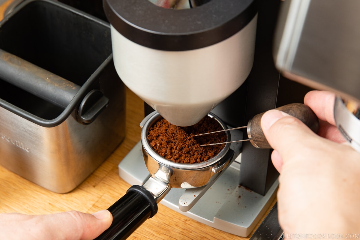ground coffee being whisked