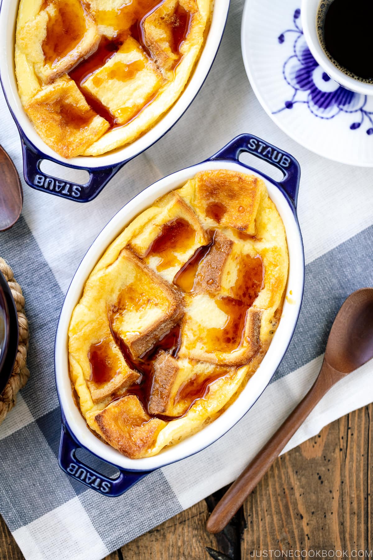 A gratin dish containing Pan Pudding (Japanese Bread Pudding) topped with a caramel sauce.
