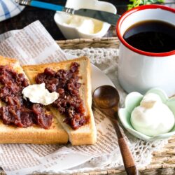 A Japanese shokupan toast topped with butter, sweet red bean paste, and fresh whipped cream.