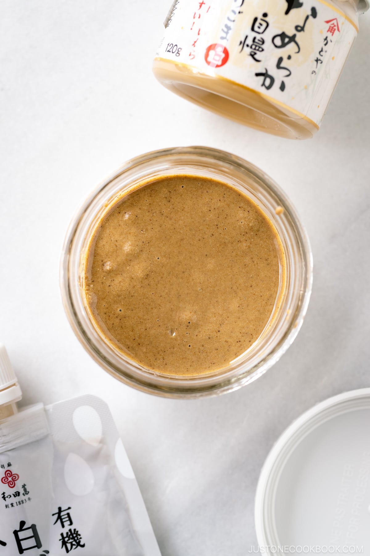 A mason jar containing freshly ground Nerigoma (Japanese white sesame paste).