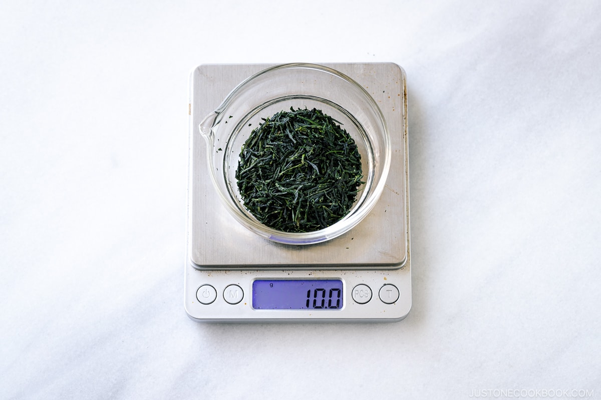tea leaves in a glass jar on a small scale