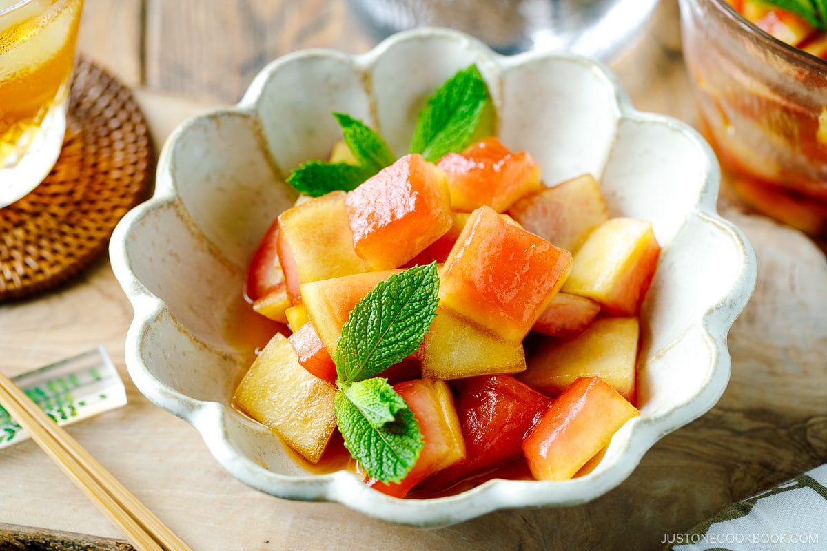 A fluted bowl containing Pickled Watermelon Rind.