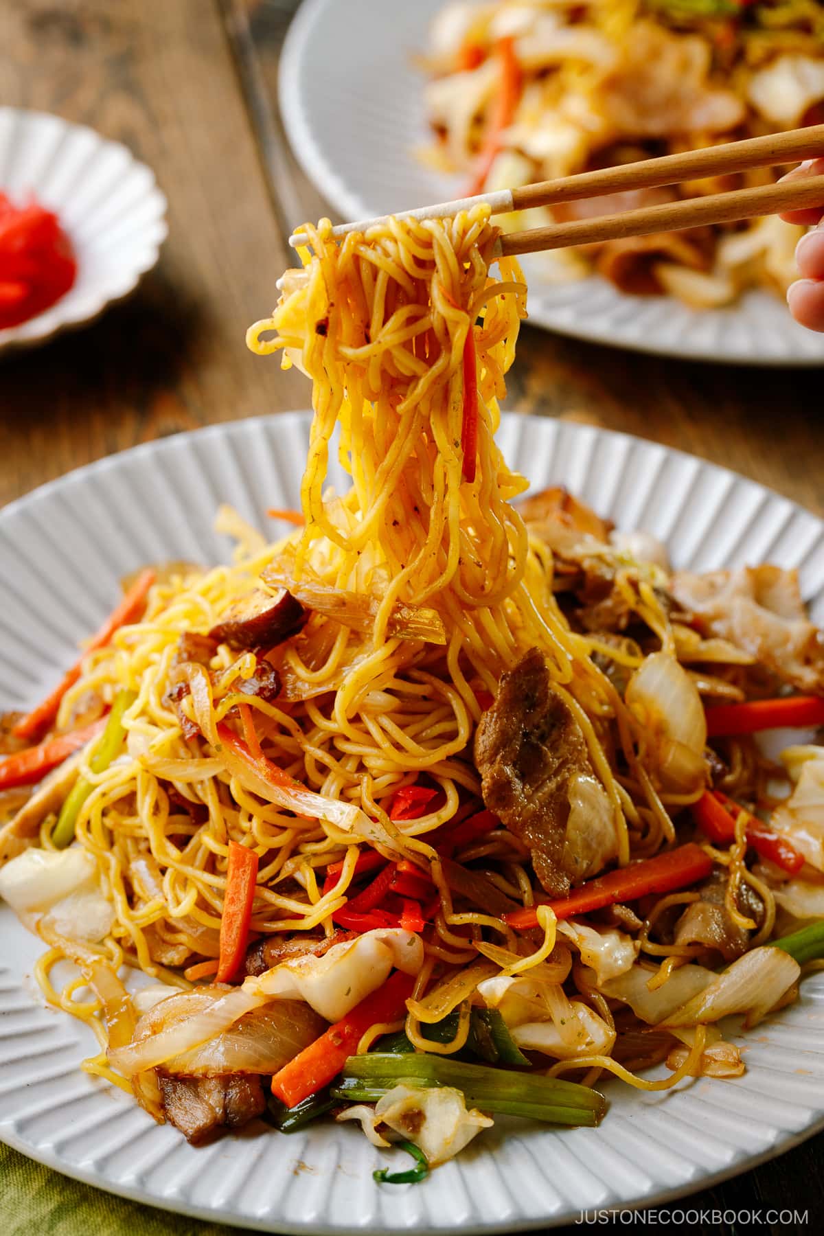 A fluted plate containing Yakisoba (Japanese Stir-Fried Noodles).