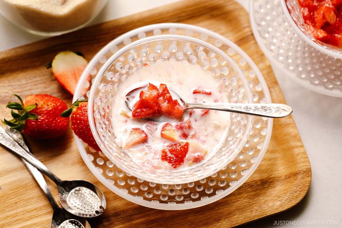 A glass bowl containing Showa-style Japanese strawberry milk called Ichigo Milk.