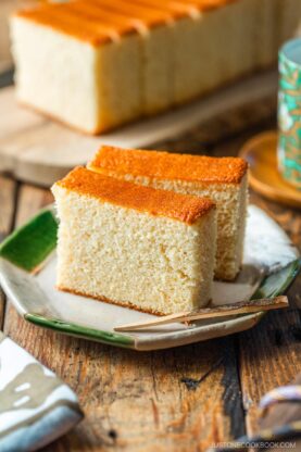 An octagon plate containing two slices of Castella cake.