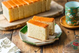 An octagon plate containing two slices of Castella cake.