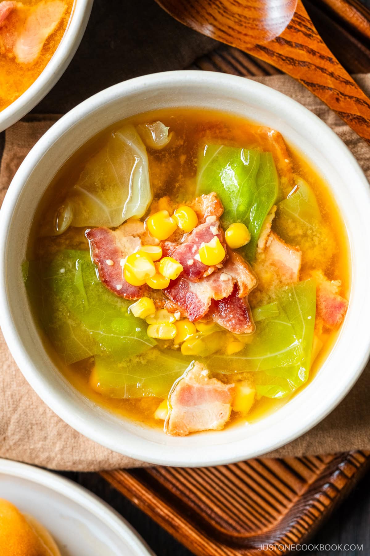 White ceramic bowls containing Bacon and Corn Miso Soup.