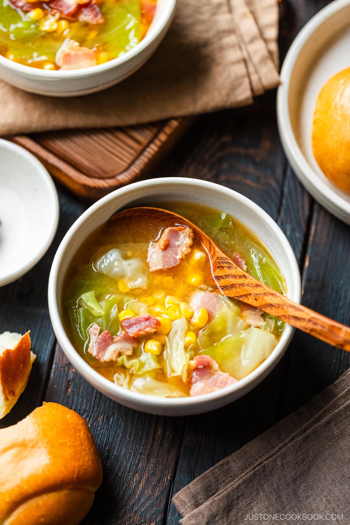 White ceramic bowls containing Bacon and Corn Miso Soup.