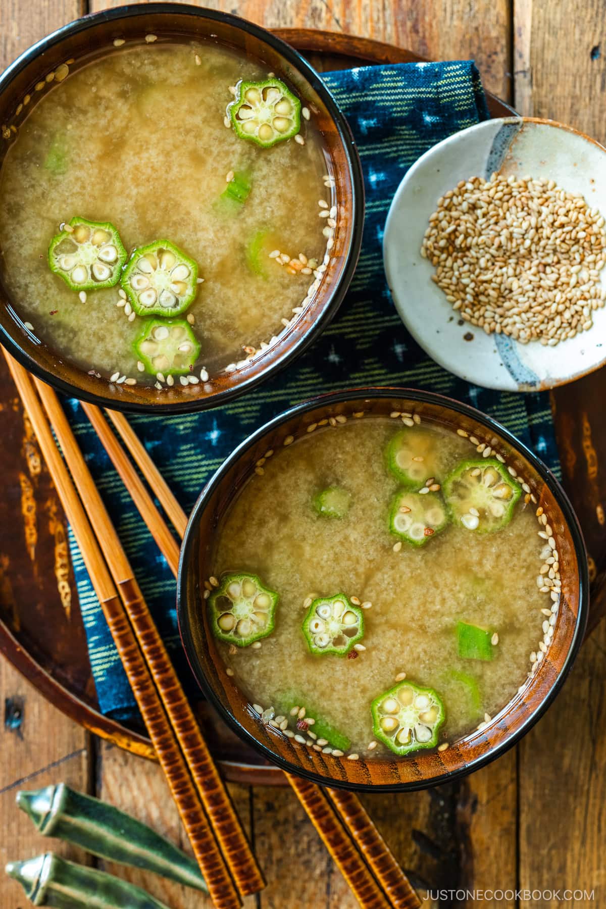 Miso soup bowls containing Natto and Okra Miso Soup topped with sesame seeds.