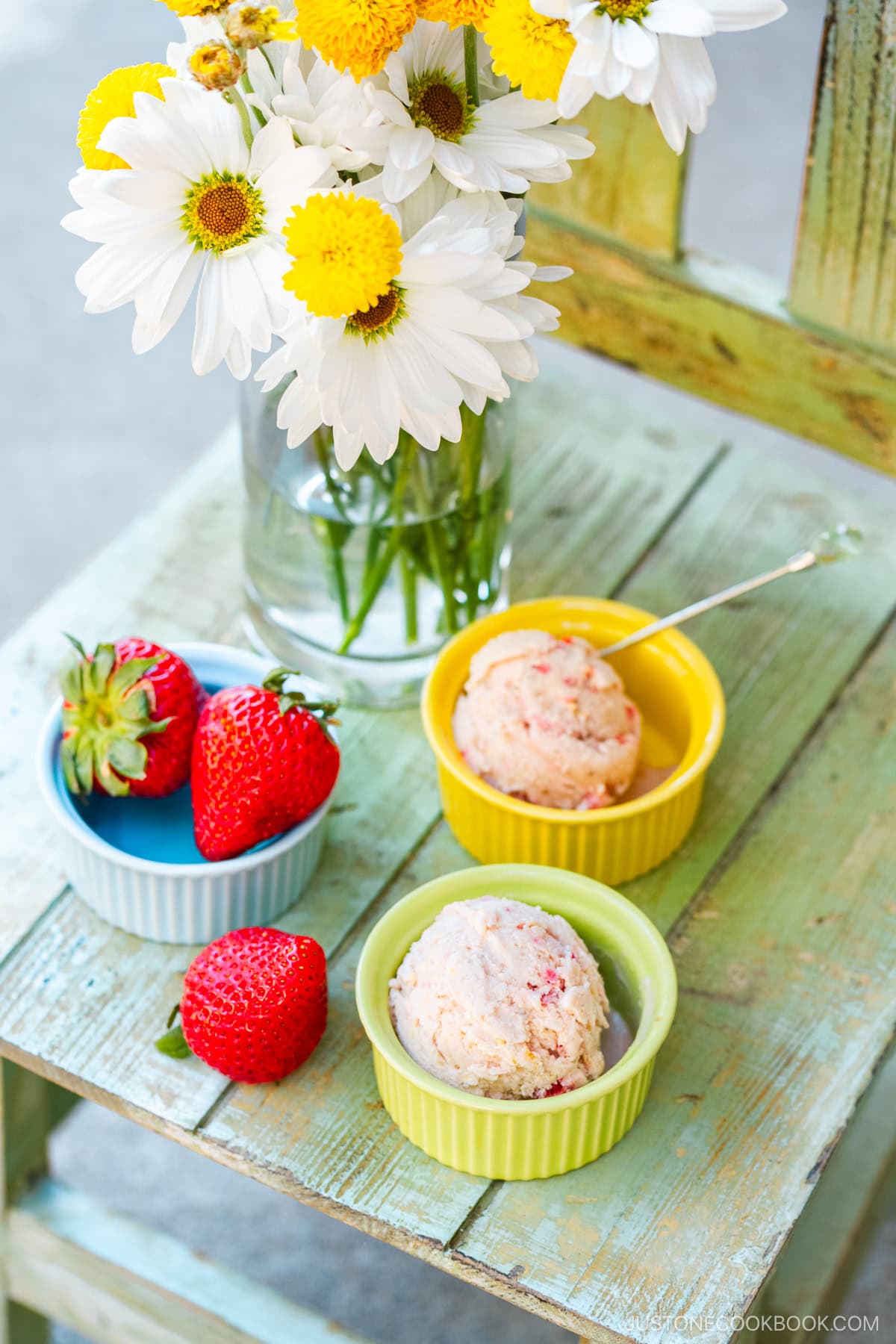 Ramekins containing strawberry ice cream.
