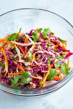 Asian coleslaw in a glass bowl.
