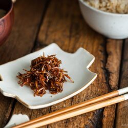 Baby Sardine Tsukudani (Jako Tsukudani) on a white ceramic plate.