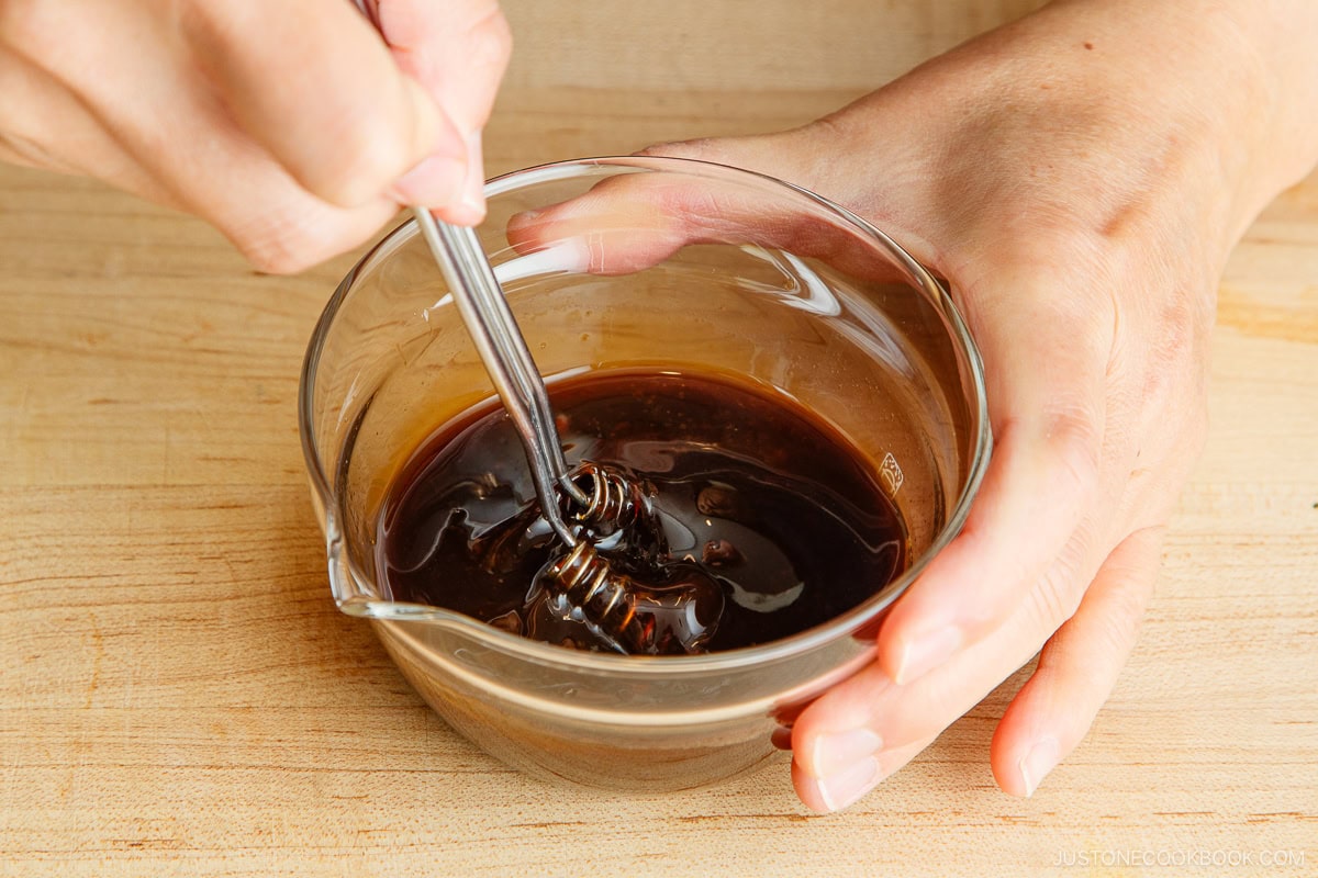 Mixing the yakisoba sauce ingredients in a bowl.
