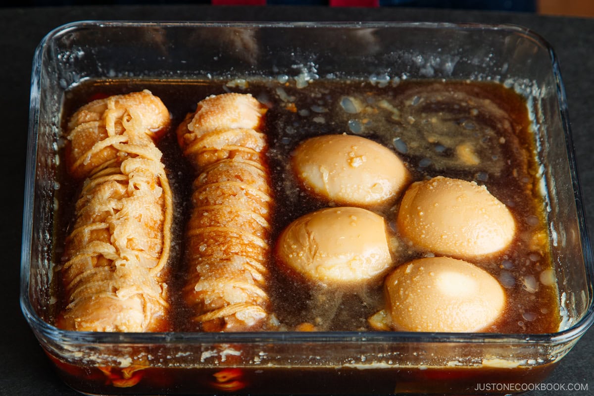 Rolled chicken chashu, peeled boiled eggs, and braising sauce after refrigerating a day.
