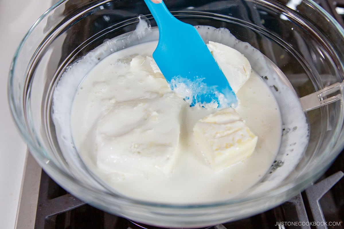 Melting the cream cheese in the double boiler.