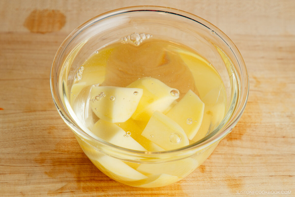 Soaking potato in water.