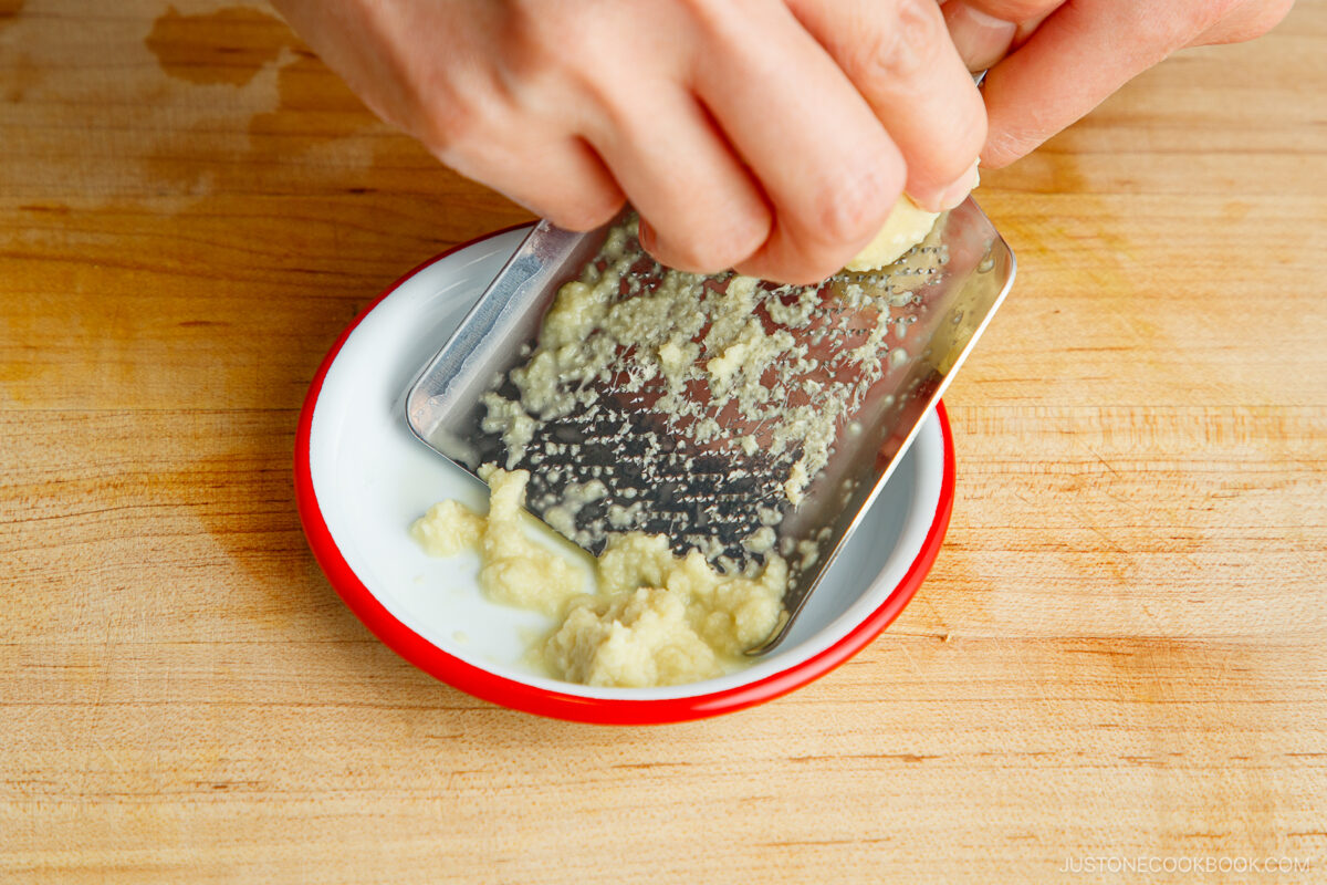 Grating the ginger.