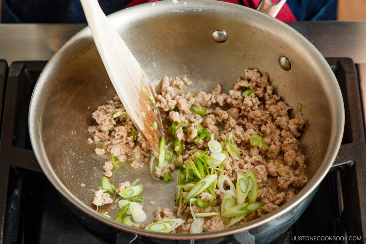 Adding the green onion.