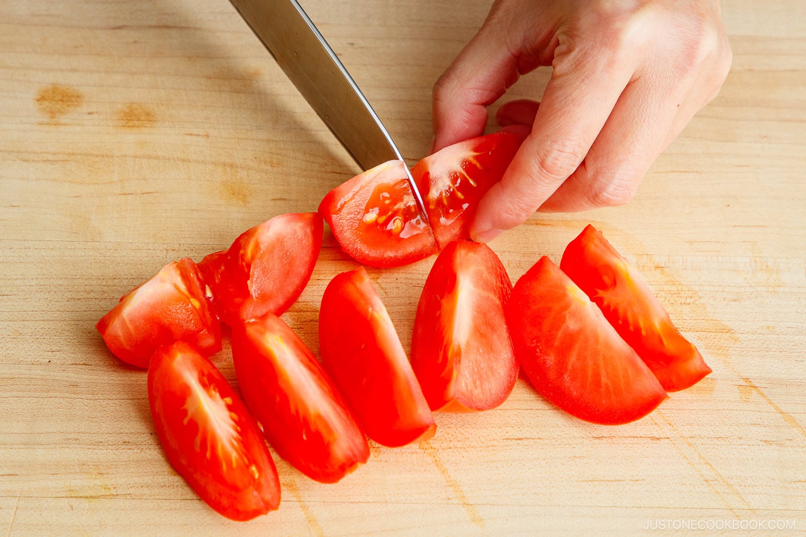 Cut the tomato to bite size pieces.