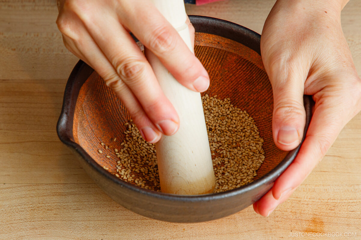 Grind the sesame seeds in a Japanese mortar.