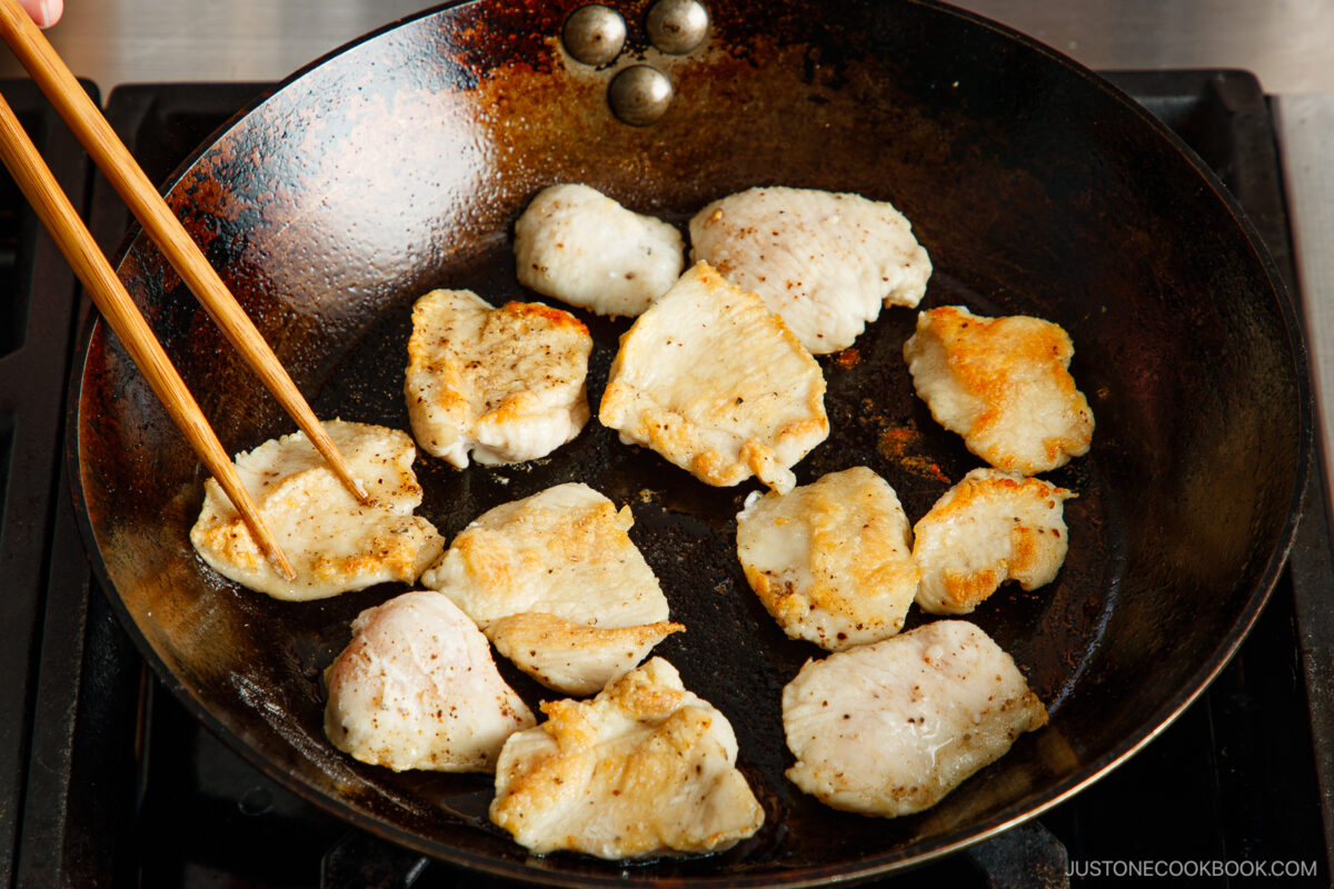 Sear the chicken on both sides.