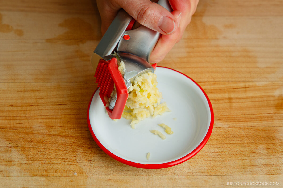 Crush the garlic cloves.