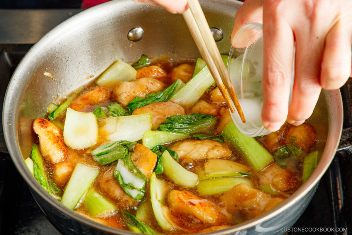 Add the potato starch slurry to the pot.