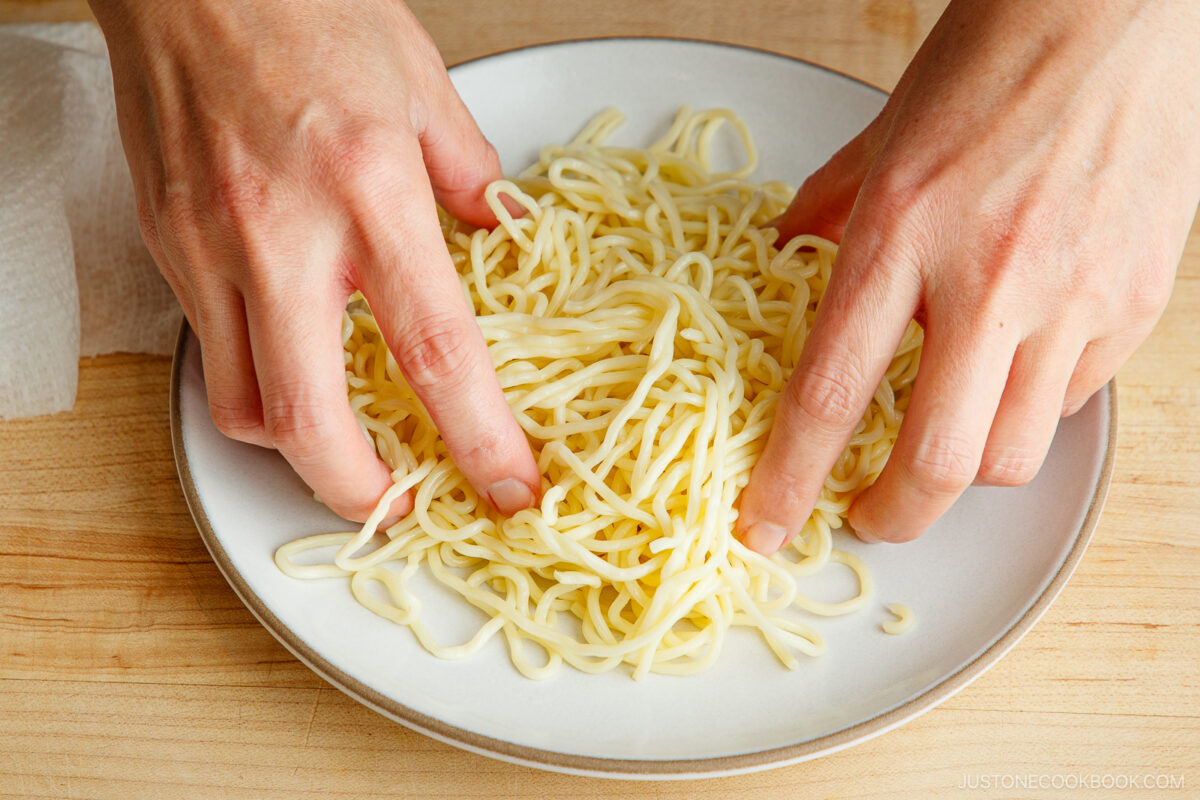 Loosen up the noodles after microwaving.