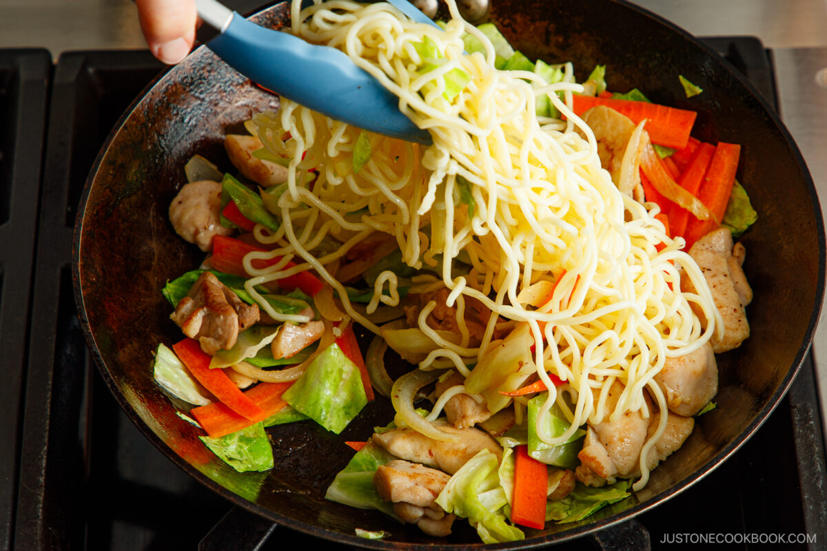Stir fry the noodles along with the vegetables and chicken.