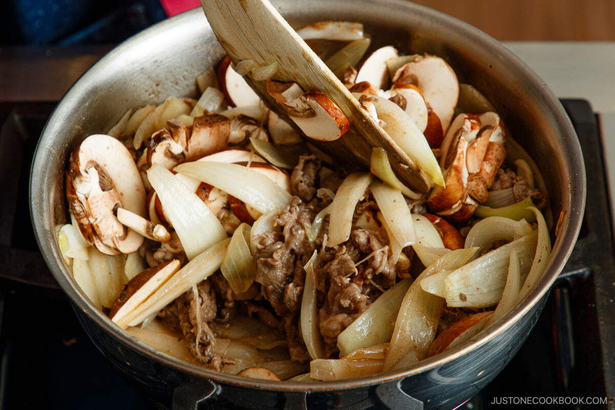 Saute the onions, beef, and mushrooms.
