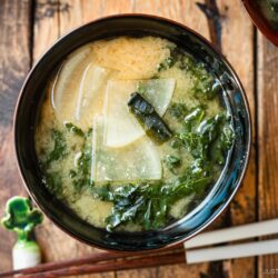 A lacquerer miso soup bowl containing Kale Daikon Miso Soup.
