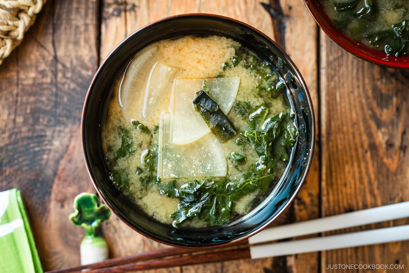 A lacquerer miso soup bowl containing Kale Daikon Miso Soup.