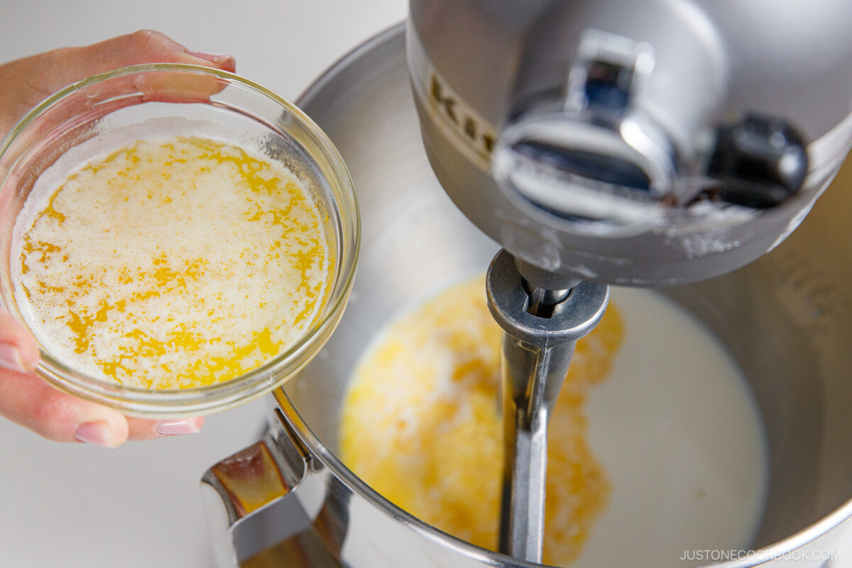 Mixing the batter into the wet ingredients.